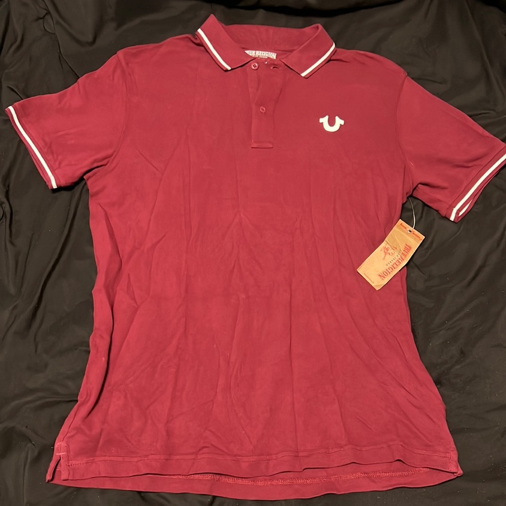 Never been worn before still has tag on shirt. Was a gift that didn’t fit